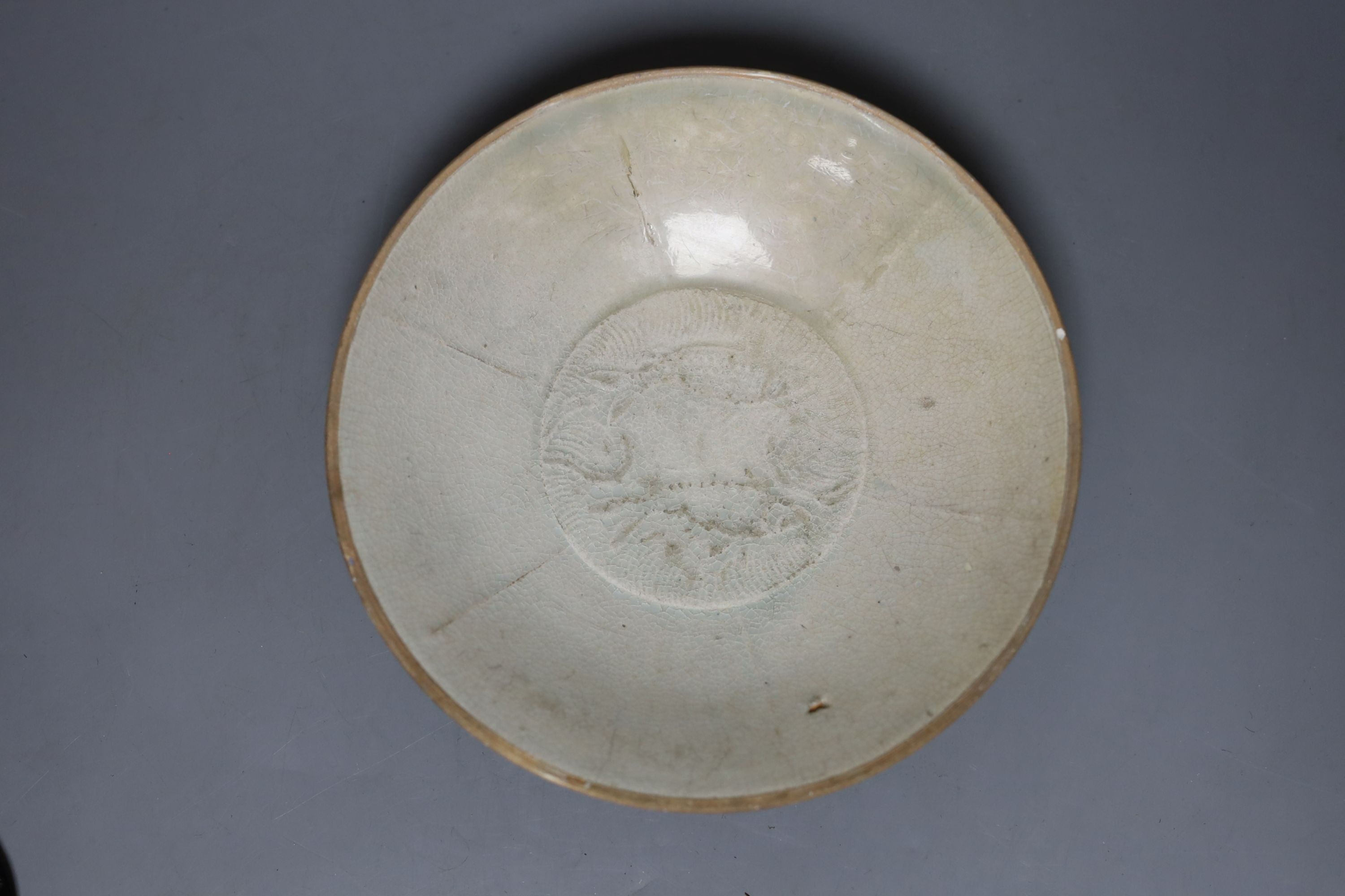 A Chinese studio pottery dish together with another two Chinese ceramics and a wood ox group, 26cm long, (4)